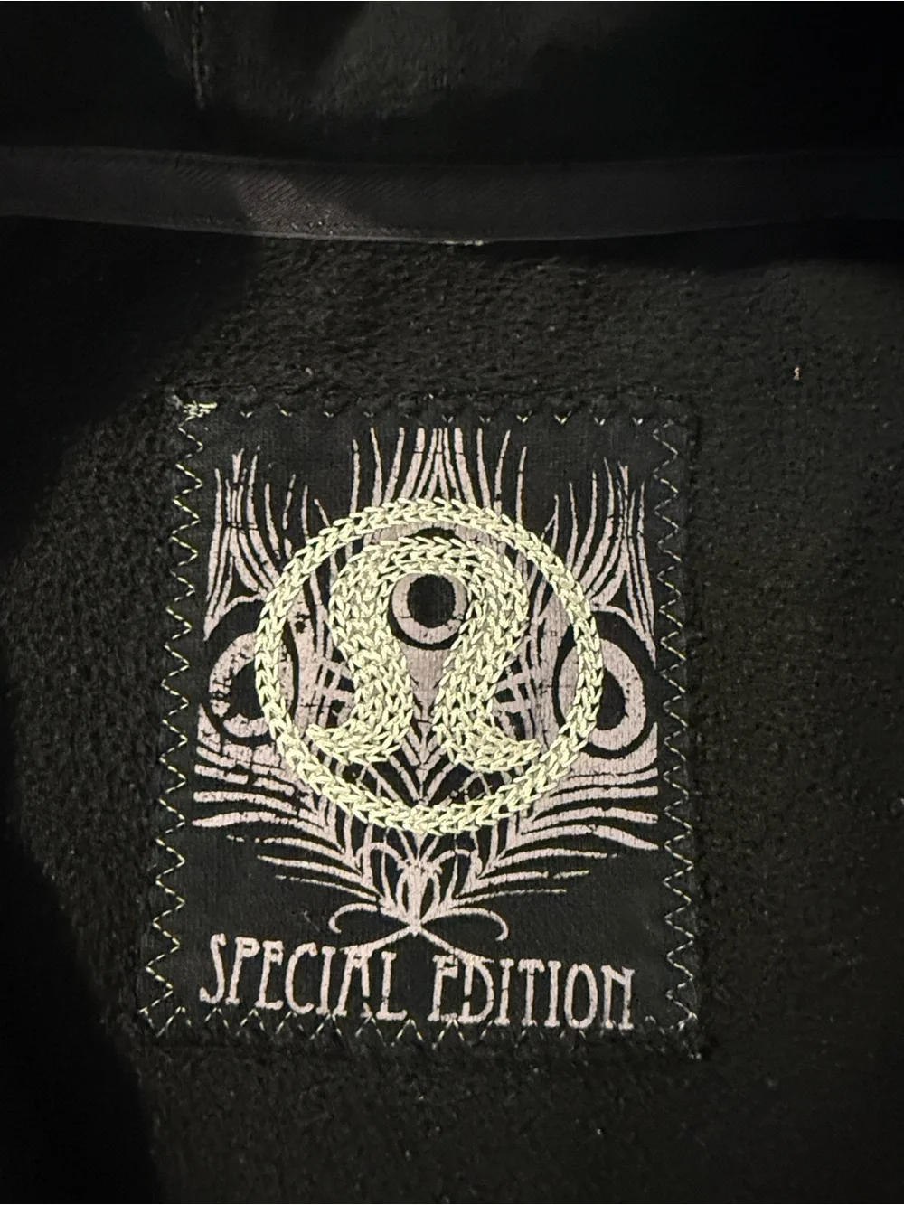 lululemon athletica. Special edition.  black jacket with ruffle trim and hood.